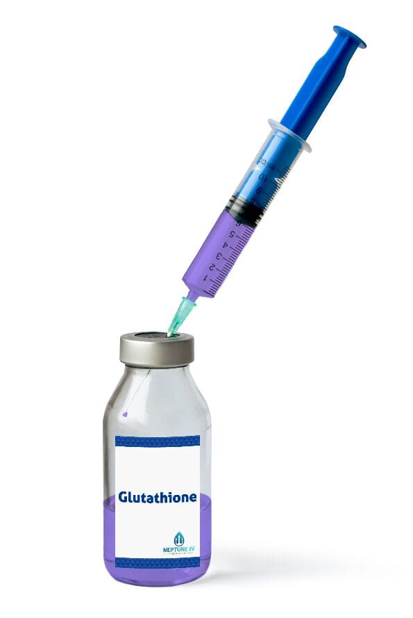 A medical syringe drawing a green liquid from a vial labeled "glutathione" for IV hydration treatment.