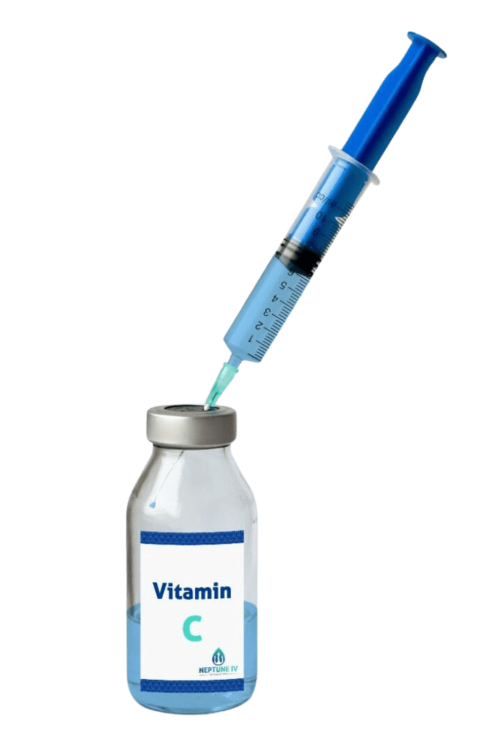 A syringe drawing a bright blue liquid from a bottle labeled "vitamin C" for IV hydration therapy.